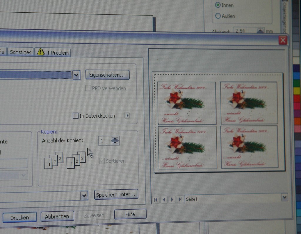 Druckdialog am Monitor: Vorschau mit vier Tassenmotiven Frohe Weihnachten 2009, roter Stern und Tannenzweig, für den Druck auf Sublimationspapier