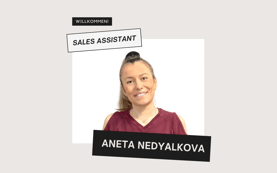 Welcome image: a smiling Aneta Nedyalkova, our new sales assistant, with her hair in a bun and wearing a burgundy top, against a light-coloured background