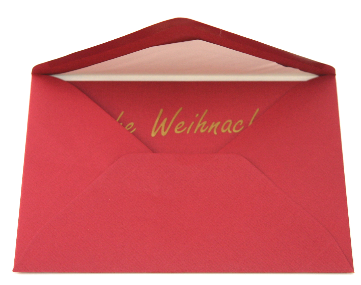 Offenes rotes Kuvert mit roter Karte, darauf geplotteter goldener Folienschriftzug Weihnachten, teilweise verdeckt