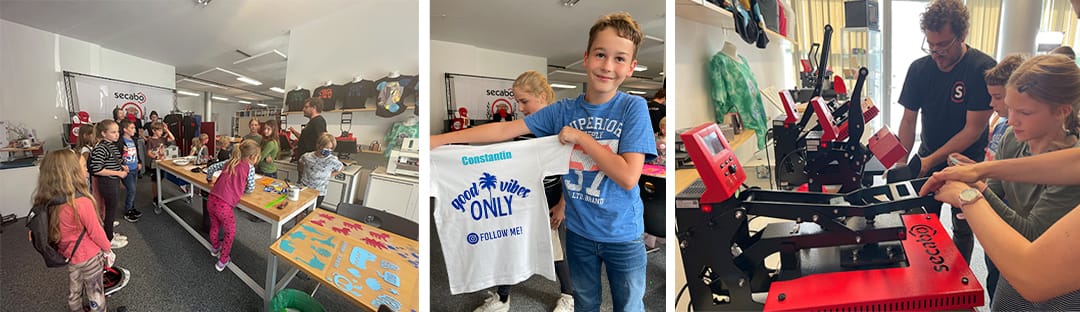 Ferienpass-Kinder im Secabo-Showroom: Junge zeigt sein bedrucktes T-Shirt, Kinder arbeiten mit Mitarbeiter an der Transferpresse