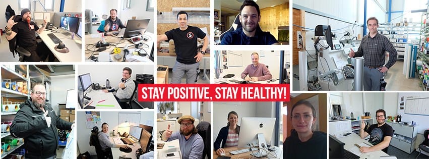Collage: Staff working from home, in the warehouse and in the workshop are giving the thumbs-up; in the centre is the slogan ‘Stay positive, stay healthy!’